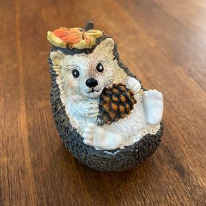 Adorable hedgehog 🦔 in the leaves with a pinecone figurine